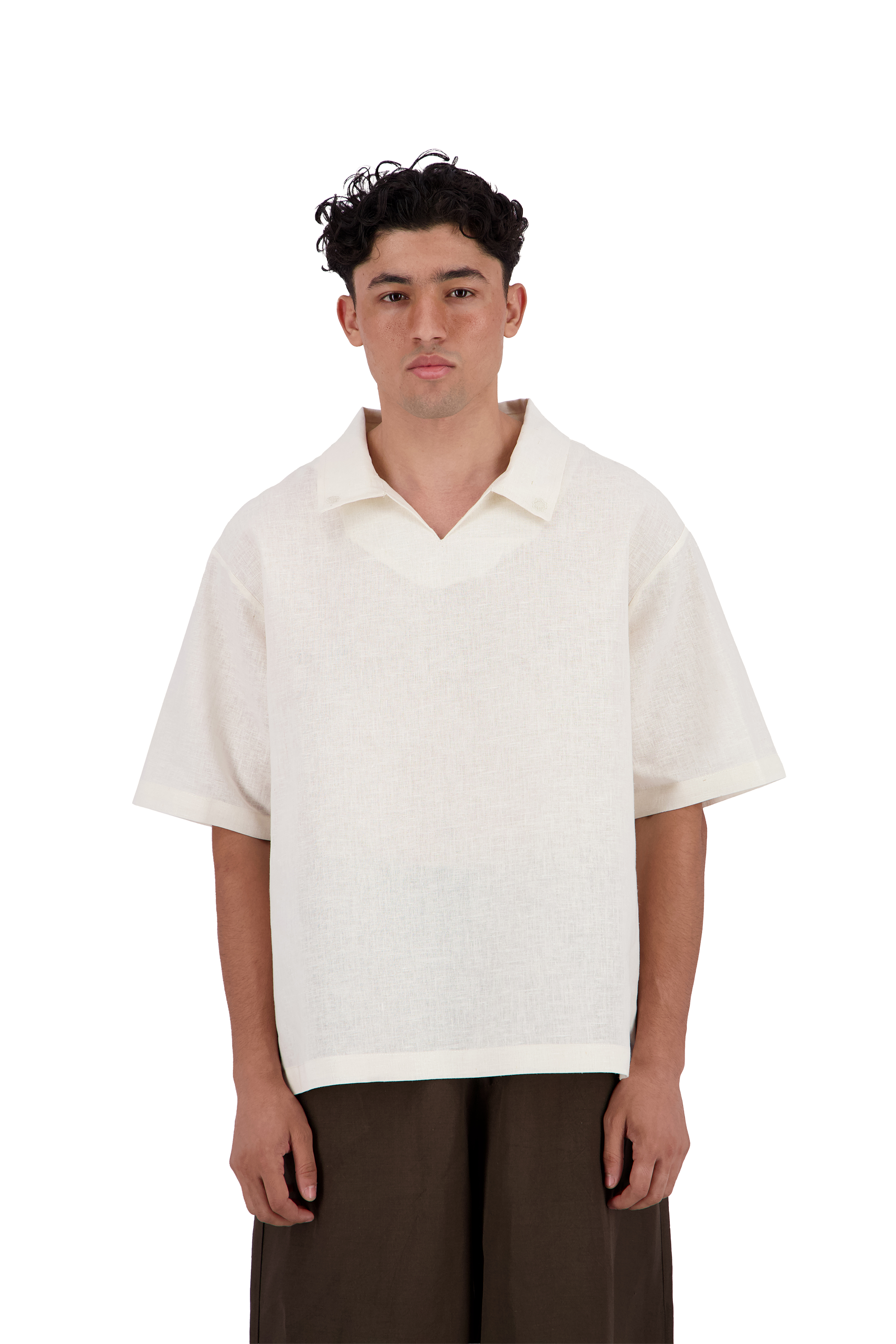 A man wearing a short-sleeve, v-neck knit polo shirt in off-white, paired with dark brown trousers, standing against a solid white background. #Milk_Dune